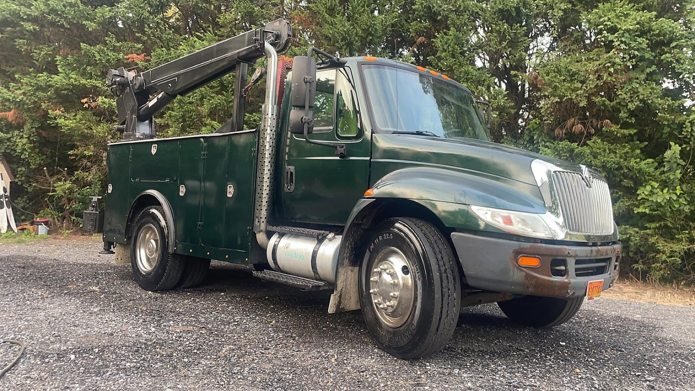 The CP Repair service truck with its crane, parked on gravel in Preston, Maryland